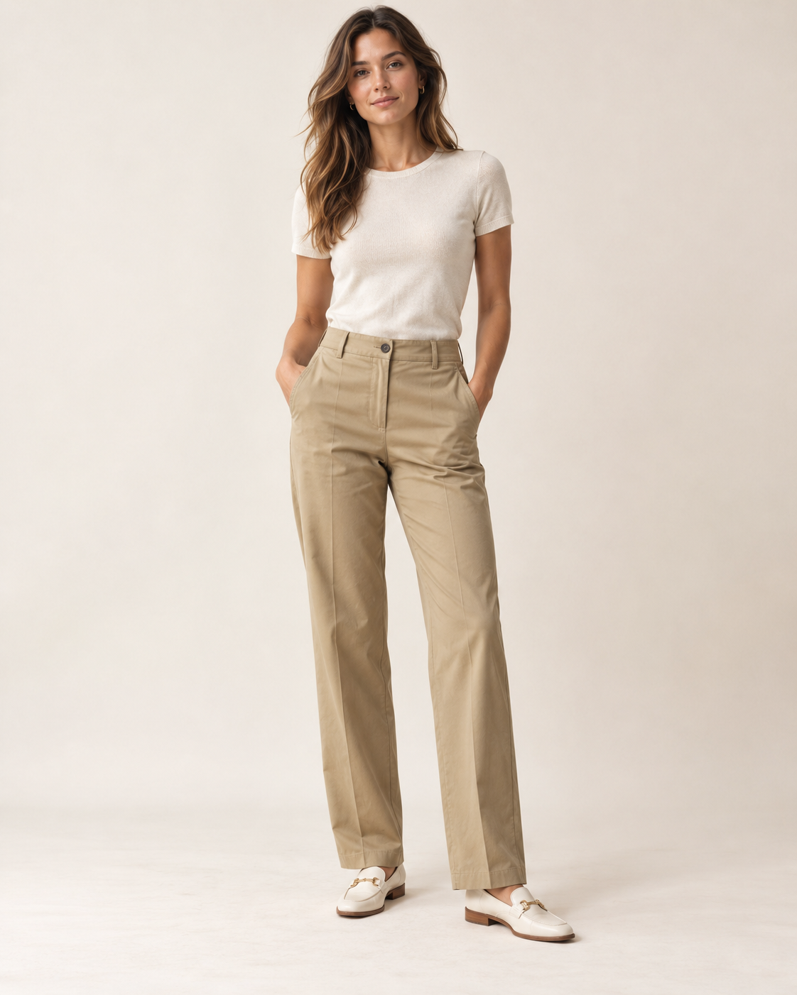 Woman wearing Liora tailored chino trousers in sand